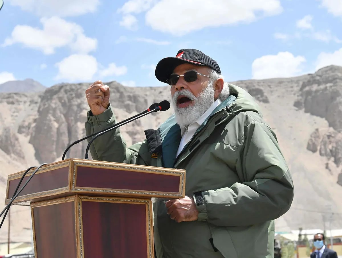 [Image of Prime Minister Narendra Modi addressing a gathering of soldiers and civilians in Ladakh]