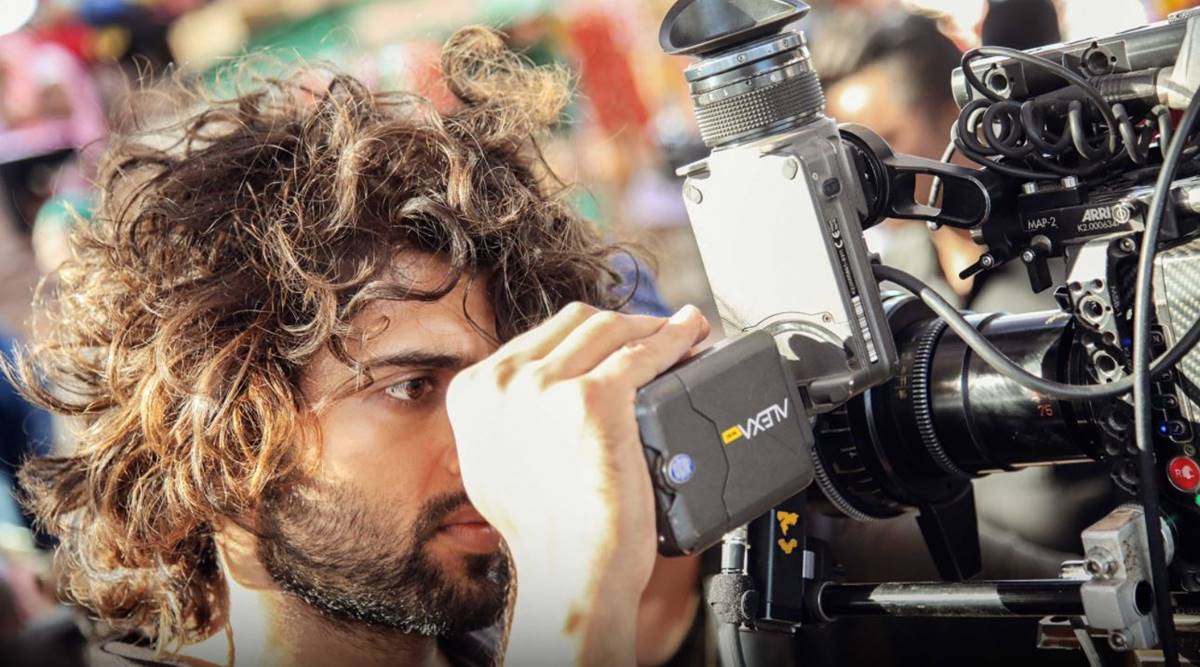 [Image of Behind-the-scenes image of the films director and Vijay Deverakonda]