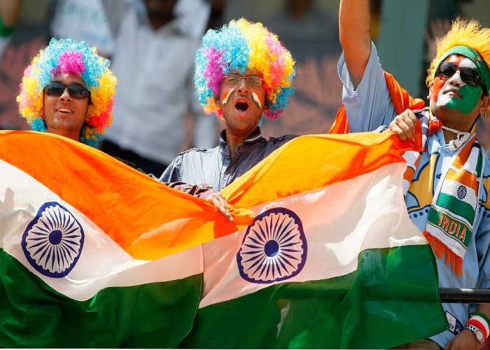 [Image of Cricket fans cheering]